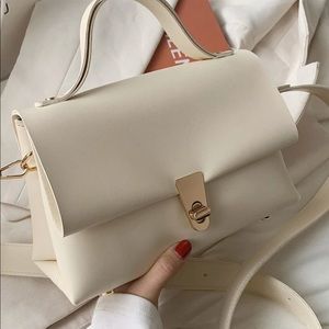 Minimalist twist lock flap satchel bag. Never worn great condition